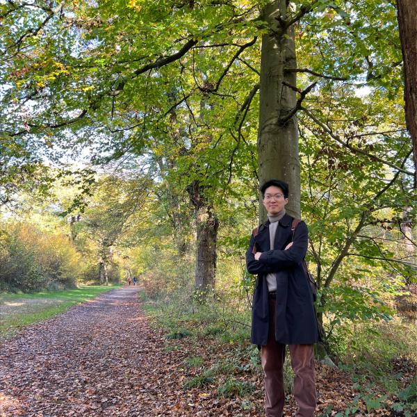portrait photo of Yichen Xu in a woodland