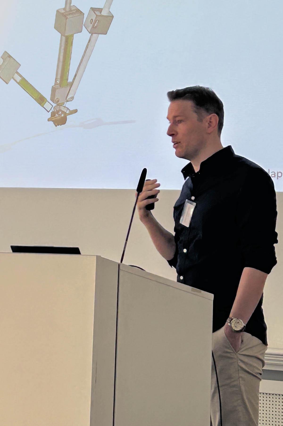 Dr Jeffrey Stedehouder giving a talk to the audience.