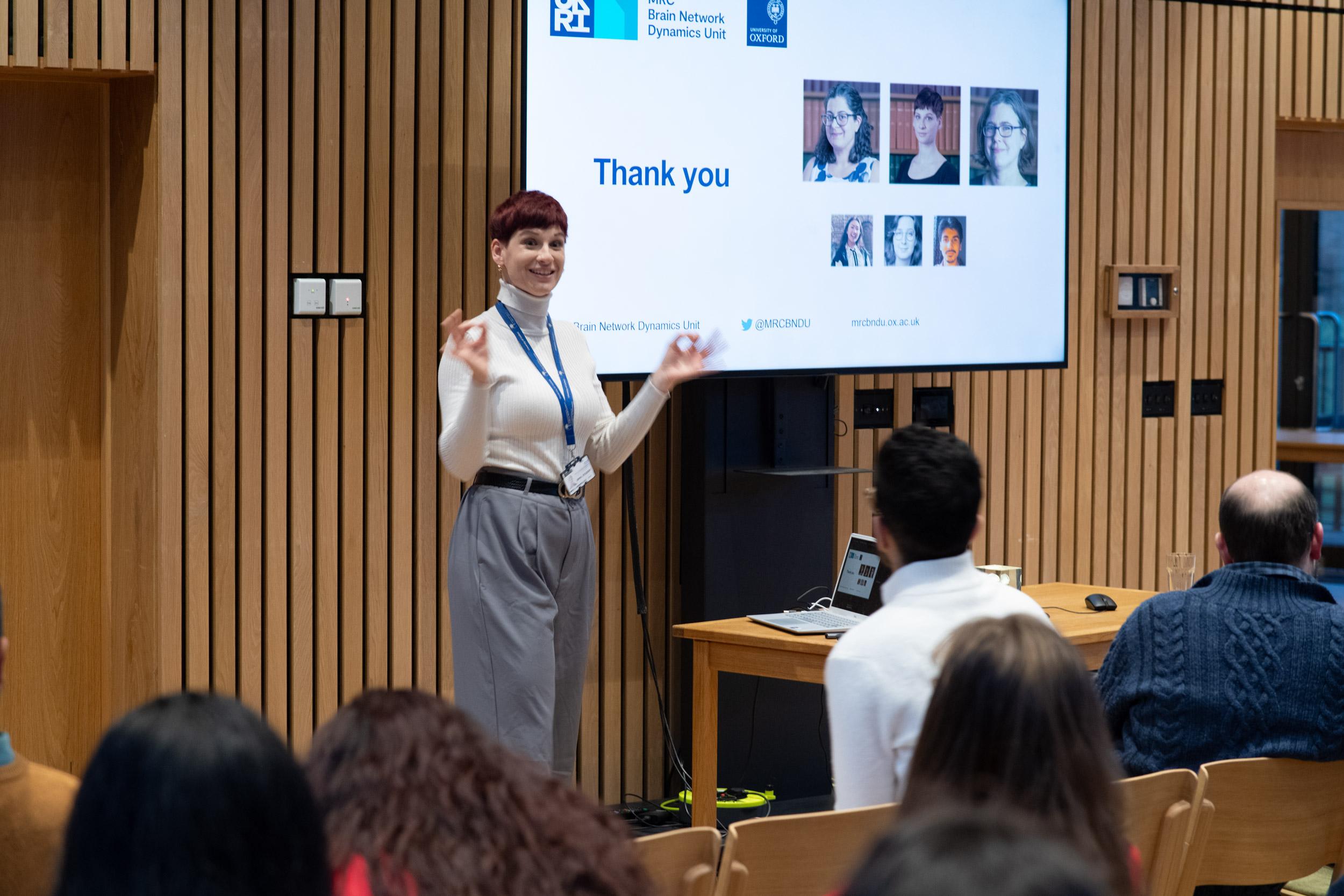 A photo of Camille Lasbareilles presenting her research to Unit colleagues.