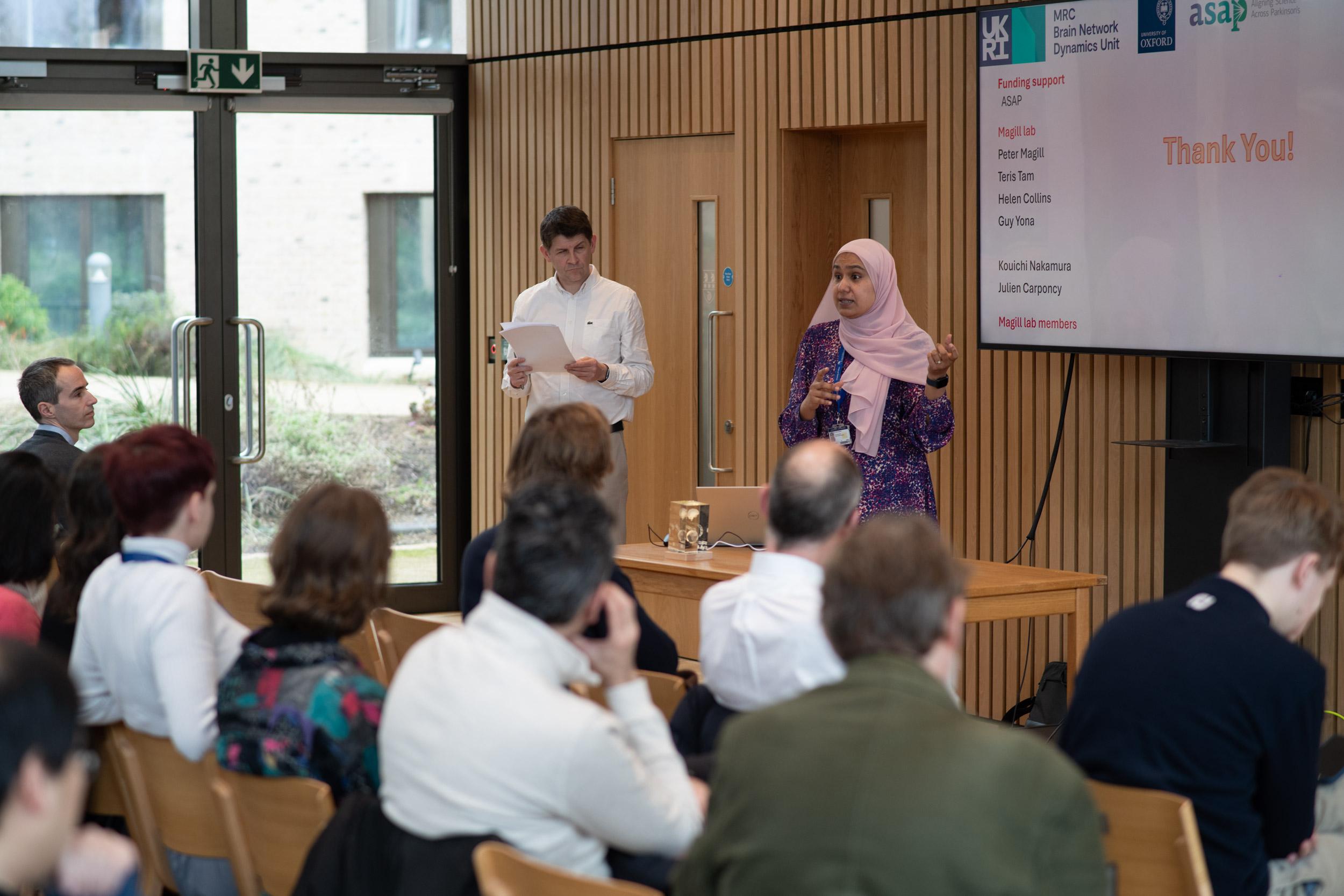 A photo of Rasha Elghaba presenting her research to Unit colleagues.