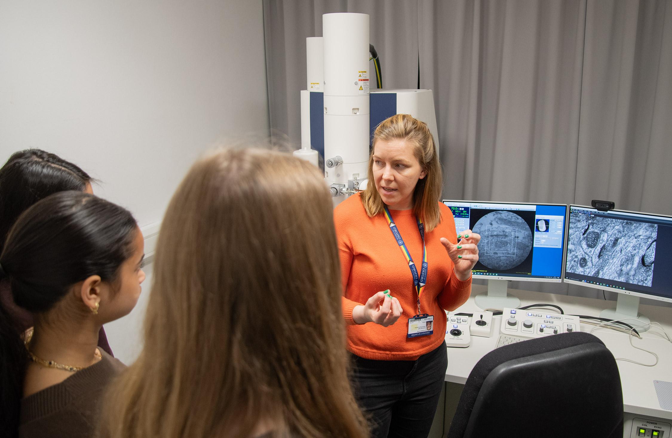 Photo of Natalie Doig, together with school pupils visiting the MRC BNDU