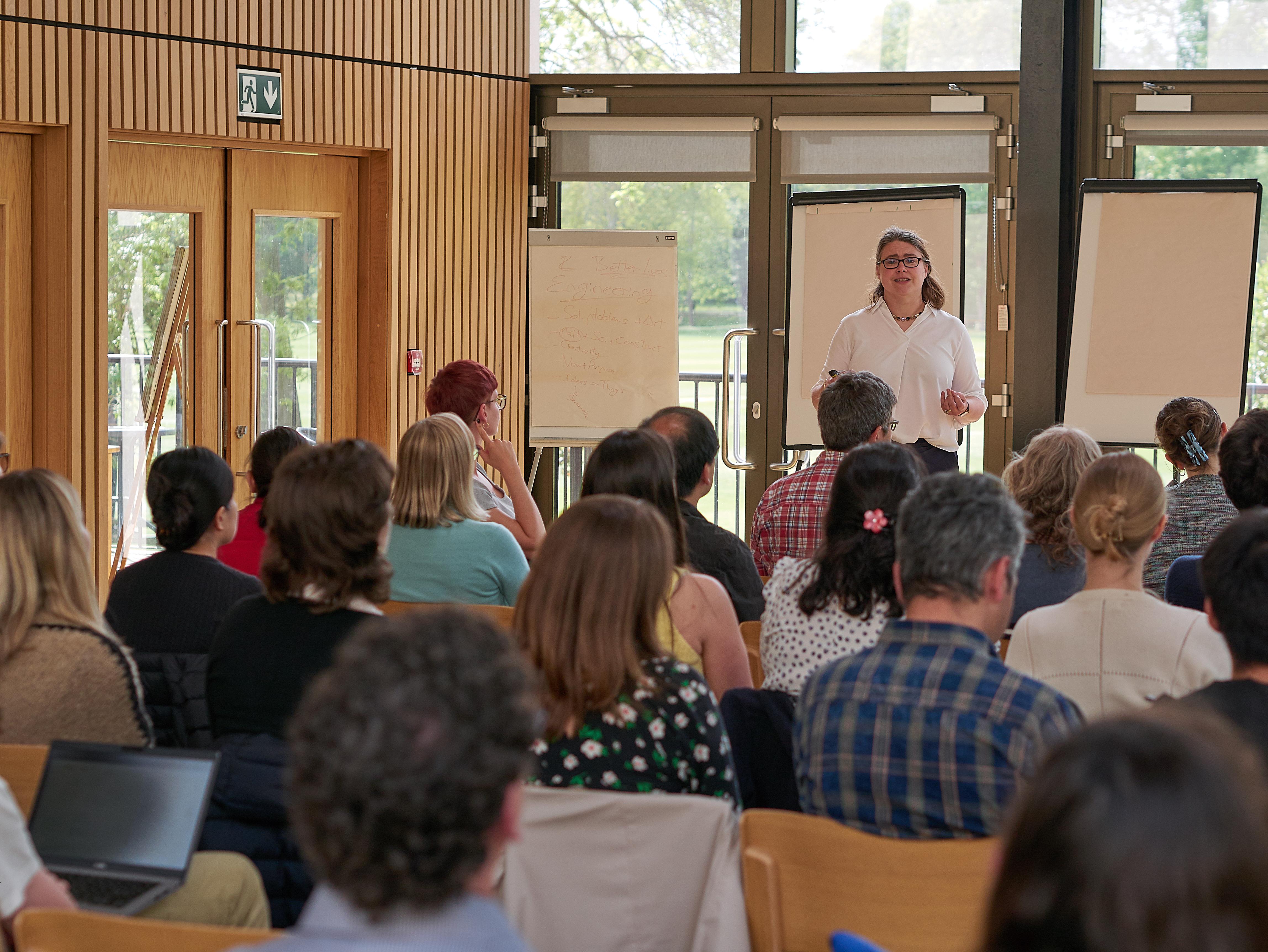 Photo of Charlotte Stagg talking to the audience at the Unit Training and Careers Development Event 2025.